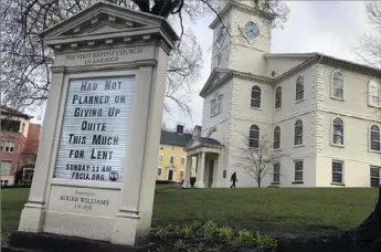  ?? William J. Kole/Associated Press ?? Americans are turning to humor in many forms, such as the sign in front of the First Baptist Church in America in Providence, R.I., as they cope with the fear and anxiety the new coronaviru­s pandemic has unleashed.