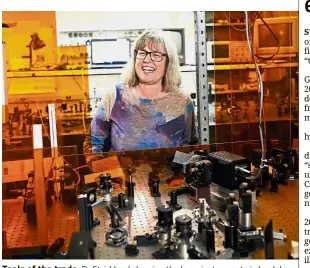  ??  ?? Tools of the trade: Dr Strickland showing the laser instrument­s in her lab at the University of Waterloo. — AFP