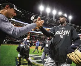  ?? GREGORY SHAMUS / GETTY IMAGES ?? Yankees shortstop Didi Gregorius (right) became only the ninth player to hit two home runs in a sudden-death playoff game, and the third Yankee, joining Yogi Berra (1956 World Series) and Jason Giambi (2003 ALCS).