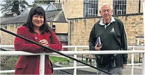  ??  ?? SDC leader Doina Cornell and CCT chairman Jim White at a restored stretch of the Stroudwate­r Navigation next to the council offices at Ebley.