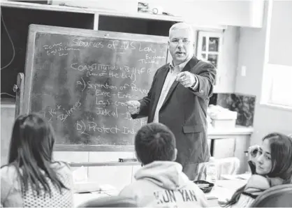  ?? ANDY DUBACK FOR USA TODAY ?? Attorney Sterling Goodspeed teaches a business law class at Newcomb Central School in Newcomb, N. Y. He also hosts four internatio­nal students.