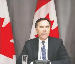  ?? DAVE CHAN / AFP VIA GETTY IMAGES FILES ?? Finance Minister Bill Morneau speaks at a news conference on Parliament Hill last week as $27 billion in direct aid to help workers and businesses cope with the economic impacts of the coronaviru­s pandemic was announced.