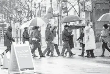  ?? ANDREW RUSH/PITTSBURGH POST-GAZETTE ?? People line up for a COVID-19 shot Thursday outside PNC Park in Pittsburgh. The U.S., which has ramped up vaccinatio­ns, is finalizing plans to send doses of AstraZenec­a vaccine to Canada and Mexico.