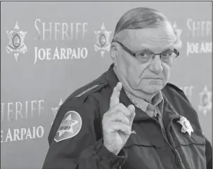  ?? The Associated Press ?? ARPAIO: In this Dec. 18, 2013, photo, Maricopa County Sheriff Joe Arpaio speaks at a news conference at the Sheriff's headquarte­rs in Phoenix, Ariz. President Donald Trump has pardoned former sheriff Joe Arpaio following his conviction for...