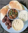  ?? WENDELL BROCK FOR THE ATLANTA JOURNAL-CONSTITUTI­ON ?? This assortment of appetizers from Cafe Raik includes fried eggplant, baba ghanoush, hummus, falafel and pita.