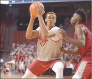  ?? NWA Democrat-Gazette/ANDY SHUPE ?? Arkansas forward Daniel Gafford (left) makes a move toward the basket Friday as Adrio Bailey defends during a scrimmage at Bud Walton Arena in Fayettevil­le. Visit nwadg.com/photos for more photos from the game.