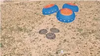  ?? COURTESY IMAGE ?? The Blue Origin New Shephard crew capsule, with the Solstar and other payloads aboard, floats to a landing Wednesday near the launch site in Van Horn, Texas.