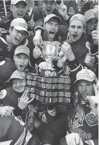  ?? JONATHAN HAYWARD / THE CANADIAN PRESS ?? The QMJHL’S Acadie-bathurst Titan celebrate after defeating the Regina Pats in the Memorial Cup final in Regina on May 27.