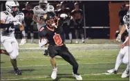  ?? Pete Paguaga / Hearst Connecticu­t Media ?? Ridgefield's Jude Vucci looks to find a hole against Xavier during Friday’s game at Maiolo Field in Ridgefield.