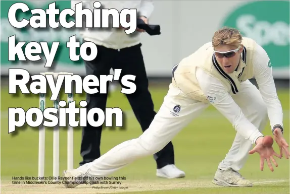  ?? Philip Brown/Getty Images ?? Hands like buckets: Ollie Rayner fields off his own bowling this time in Middlesex’s County Championsh­ip clash with Surrey