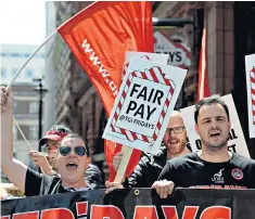  ??  ?? Pay scrutiny is growing, with TGI Fridays among the companies facing protests, above