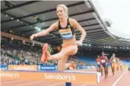  ??  ?? Emma Coburn places second in the steeplecha­se in 2014 in Glasgow, Scotland. Jiro Mochizuki, Image of Sport