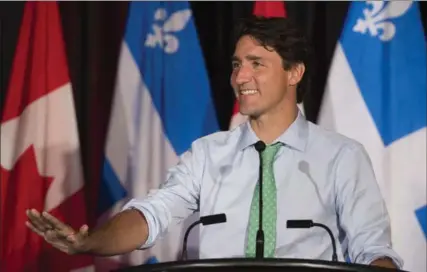  ?? JACQUES BOISSINOT, THE CANADIAN PRESS ?? Prime Minister Justin Trudeau speaks at the beginning of a two-day caucus meeting in Saguenay, Quebec on Thursday.