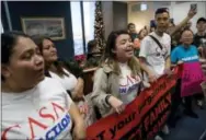  ?? ANDREW HARNIK—THE ASSOCIATED PRESS ?? Protesters take over the waiting room of the offices of Senate Minority Leader Sen. Chuck Schumer, D-N.Y., to demand that the Senate pass a clean DREAM Act, on Capitol Hill, Tuesday, in Washington.