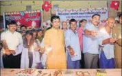  ??  ?? Kota district collector Om Prakash Kasera (in orange kurta) and other officials celebrate Diwali at Apna Ghar in Kota. HT PHOTO