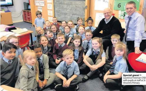  ??  ?? Special guest Fr Laurence Freeman OSB with pupils at staff at St Vincent’s Primary