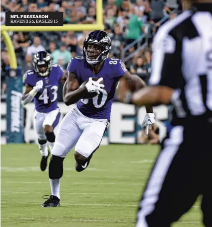  ?? ULYSSES MUÑOZ/BALTIMORE SUN ?? Ravens receiver Miles Boykin runs after receiving a pass from quarterbac­k Trace McSorley in Thursday night’s game.