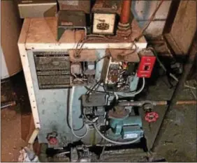  ?? L.A. PARKER — THE TRENTONIAN ?? A repairman showed to fix this basement heater. He left to find a part but never returned.