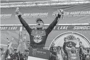  ?? [AP PHOTO] ?? Kevin Harvick celebrates in Victory Lane after winning a NASCAR Cup Series auto race at New Hampshire Motor Speedway, Sunday in Loudon, N.H.