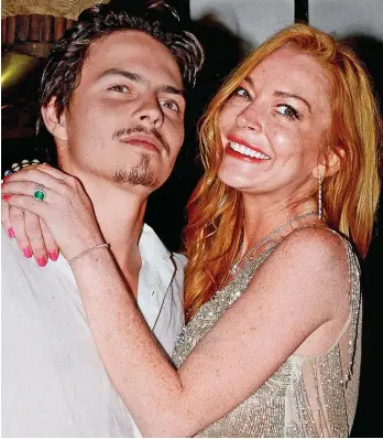  ??  ?? Messy break-up: Actress Lindsay Lohan with her ex-fiance Egor Tarabasov