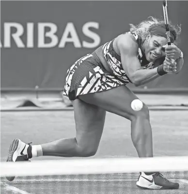  ?? PAVEL GOLOVKIN/AP ?? Serena Williams plays a shot against Vitalia Diatchenko during their first-round match of the 2019 French Open.