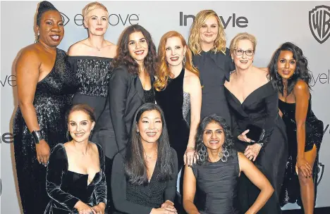  ??  ?? Back, from left: Tarana Burke, Michelle Williams, America Ferrera, Jessica Chastain, Amy Poehler, Meryl Streep, and Kerry Washington. Front, Natalie Portman, Ai-jen Poo, and activist Saru Jayaraman at the Post-Golden Globes Party at The Beverly Hilton...