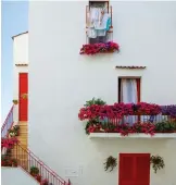  ??  ?? From left: A view of the harbour of Kotor, Montenegro, Above: A house with flowers in Monopoli, Italy