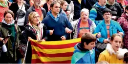  ??  ?? People hold Catalan pro-independen­ce Estelada flags and Basque Country flags during a demonstrat­ion in village of Beasain, northern Spain, on Sunday. —