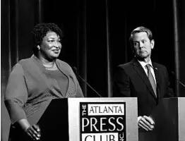  ?? JOHN BAZEMORE/AP ?? According to Georgia polls, Democratic gubernator­ial candidate Stacey Abrams is almost neck-and-neck with her Republican opponent, Secretary of State Brian Kemp.