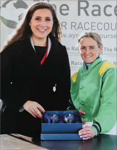  ??  ?? Karen Kenny from Cahersivee­n receiving her prize after a fantastic victory at Ayr Racecourse in Scotland, in what was her first UK win ever aboard Stamp of Authority.