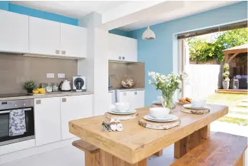  ??  ?? KITCHEN ‘When it came to the colour scheme I think we were subconscio­usly influenced by our time in Santorini,’ says Sammy. Home of colour Marina blue silk emulsion, £10 for 2.5 litres, Homebase, is a similar. Montpellie­r cheesemake­r wall clock,...