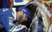  ?? MATT SLOCUM — THE ASSOCIATED PRESS ?? Jimmie Johnson talks with Chase Elliott in the garage during practice for the NASCAR Cup Series Pocono 400.