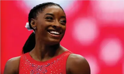  ?? Photograph: Lindsey Wasson/Reuters ?? Simone Biles was adopted by her maternal grandparen­ts after a tough start to life.