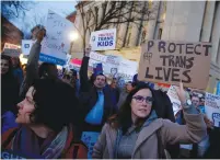  ?? (Reuters) ?? TRANSGENDE­R ACTIVISTS and supporters protest potential changes by the Trump administra­tion near the White House on Wednesday.