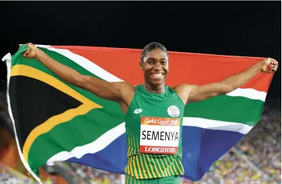  ?? AFP ?? Caster Semenya celebrates with the South African flag after winning the athletics women’s 800m final on Friday. —