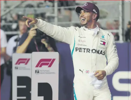  ?? AP • V. THIAN ?? EXULTANTE. Lewis Hamilton sacó a relucir su talento sobre la pista de Marina Bay y hoy tiene la oportunida­d de ampliar su ventaja en el campeonato, que es de 30 puntos.