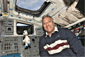  ?? ?? Astronaut Mike Massimino took the Snoopy from his boyhood into space in 2009. (NASA)