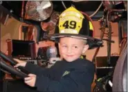  ?? TOM KELLY III — FOR DIGITAL FIRST MEDIA ?? Chase Quinter, 4, is in the driver’s seat as he takes a visit in the Amity Fire Co. pumper truck.