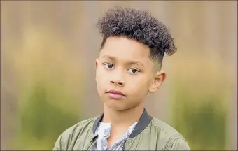  ?? Photo by Kris Groulx ?? Adrian Groulx stars as Dwayne “The Rock” Johnson at age 10 in the new NBC comedy “Young Rock” premiering at 8 p.m. on Tuesday.