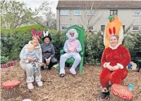  ?? ?? Colourful characters Co-op staff lent a hand at Crieff Community Garden’s Easter event