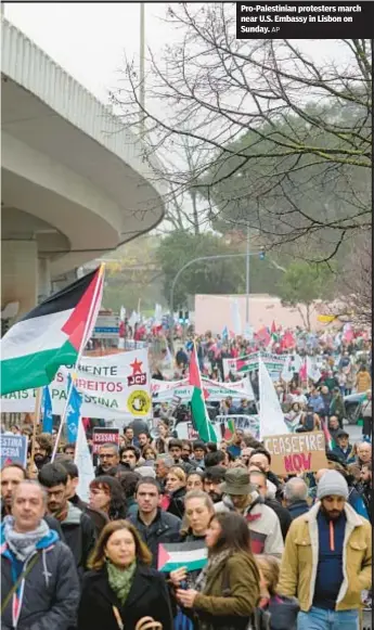  ?? AP ?? Pro-Palestinia­n protesters march near U.S. Embassy in Lisbon on Sunday.