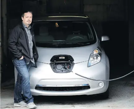  ?? ALLEN MCINNIS ?? “I feel like I’m doing my part,” says George Giannelis, owner of an all-electric Nissan Leaf. It costs him about $1 a day to charge his car.