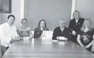  ??  ?? Rotarian representa­tives along with three of the many vendors of the Tasting with a Twist event, being hosted by the Rotary Clubs of Pictou County, show the tickets for this year’s event. From left: chef Jason Conway, owner of Fork in the Road Food Truck and J. Conway Catering; Audrey Crosby, Westville Rotary Club; Allayna Munroe, New Glasgow Rotary Club; Murray Hill, Pictou Rotary Club; Debbie Matheson, Jost Vineyards and Rebecca Whiffen, Uncle Leo’s Brewery.