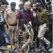  ?? — PTI ?? Deputy chief minister Manish Sisodia during his visit to Shiv Vihar, one of the riot-affected areas in northeast Delhi on Tuesday.