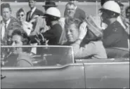  ?? JIM ALTGENS — THE ASSOCIATED PRESS ?? President John F. Kennedy waves from his car in a motorcade in Dallas. Riding with Kennedy are first lady Jacqueline Kennedy, right, Nellie Connally, second from left, and her husband, Texas Gov. John Connally, far left.