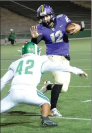  ?? BEA AHBECK/NEWS-SENTINEL ?? Tokay quarterbac­k Jacob Varney evades St. Mary's Christophe­r Parungao at the Grape Bowl on Friday.