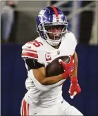  ?? Michael Ainsworth / Associated Press ?? New York Giants running back Saquon Barkley runs against the Dallas Cowboys in Arlington, Texas, on Nov. 24.