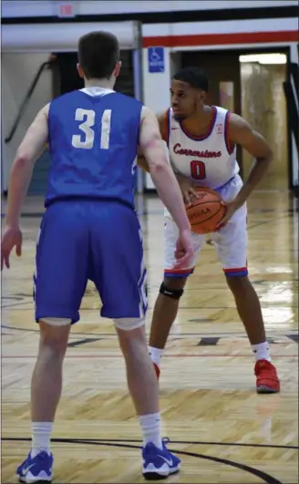  ?? DEANDRE’ PATRICK — THE NEWS-HERALD ?? Cornerston­e Christian’s Kendall Saunders is shown in a Division IV regional final win over Mansfield St. Peter’s.