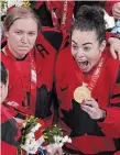  ?? ?? Team Canada’s Brianne Jenner (19) and Sarah Nurse (20) celebrate with their gold medals after defeating the United States in the women’s hockey gold medal game at the 2022 Winter Olympics in Beijing