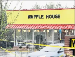  ?? MARK HUMPHREY — THE ASSOCIATED PRESS ?? Police tape blocks off a Waffle House restaurant where four people were shot dead.